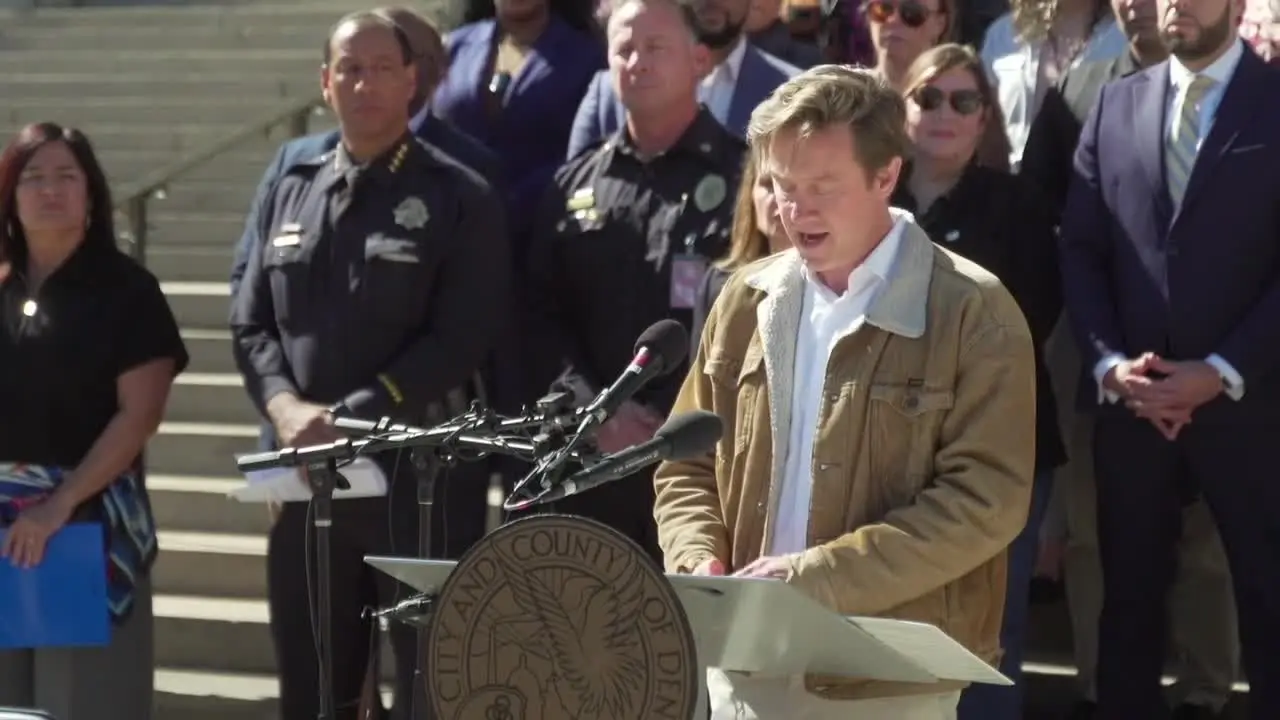 Denver Mayor Mike Johnston speaking at press conference about ICE protection order