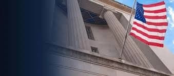 DOJ Antitrust Division headquarters with enforcement imagery