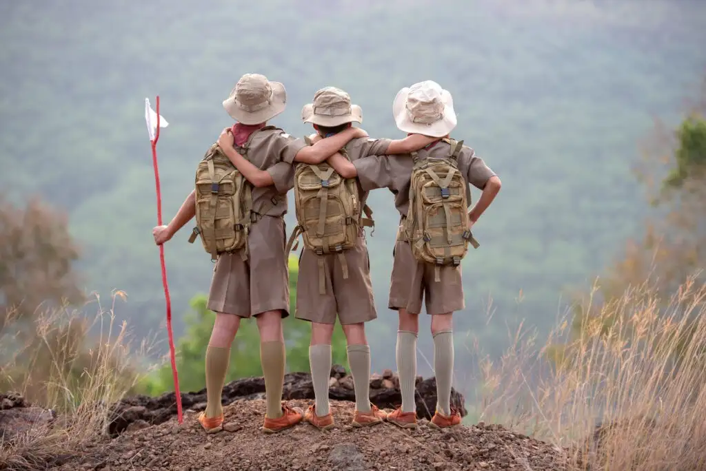 Scouting America youth members with Pentagon and American flag background